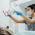 a dentist in Cinnaminson, NJ, treats a patient for cavities