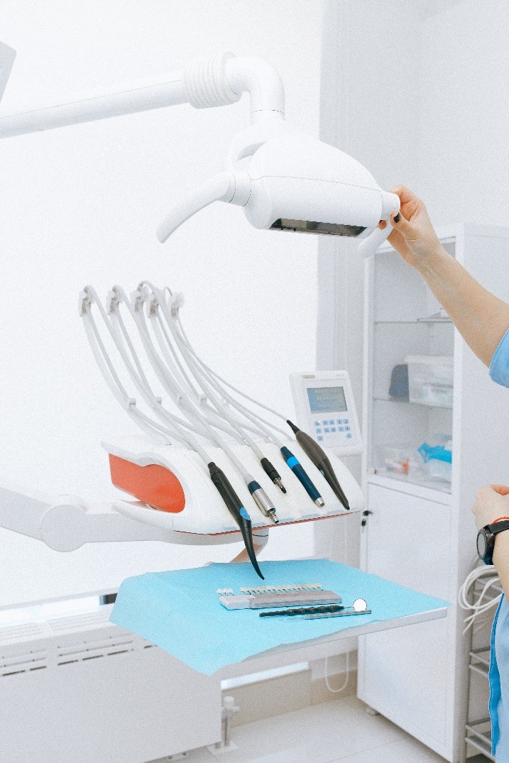 a dentist in Cinnaminson, NJ, prepares her equipment ahead of a treatment