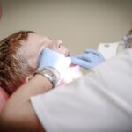 Dentist performing a root canal on a patient