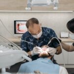 A desntist carrying out a dental procedure