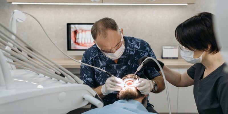 A desntist carrying out a dental procedure