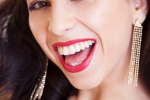 A picture of a woman with white teeth